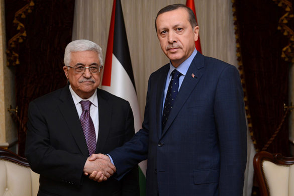 In this photo provided by the Turkish Prime Minister's Press Service, Palestinian President Mahmoud Abbas, left, and Turkish Prime Minister Recep Tayyip Erdogan pose for a photograph before a meeting in Ankara, Turkey, Tuesday, Dec. 11, 2012. Abbas received a welcoming ceremony with a 21-gun salute early in the day in recognition of the Palestinians' new status after the U.N. General Assembly last month voted to recognize the Palestinians as a non-member observer state. (AP Photo/Kayhan Ozer)