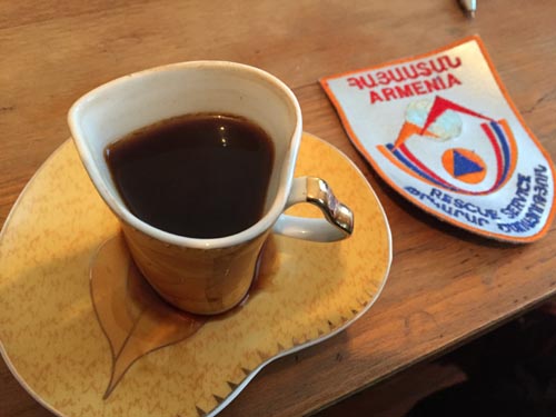 The heart shape cup of coffee and Armenian Fire patch
