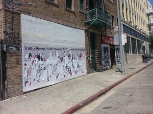 Remnants of denialist posters adjacent to Congressman Adam Schiff’s disctrict office